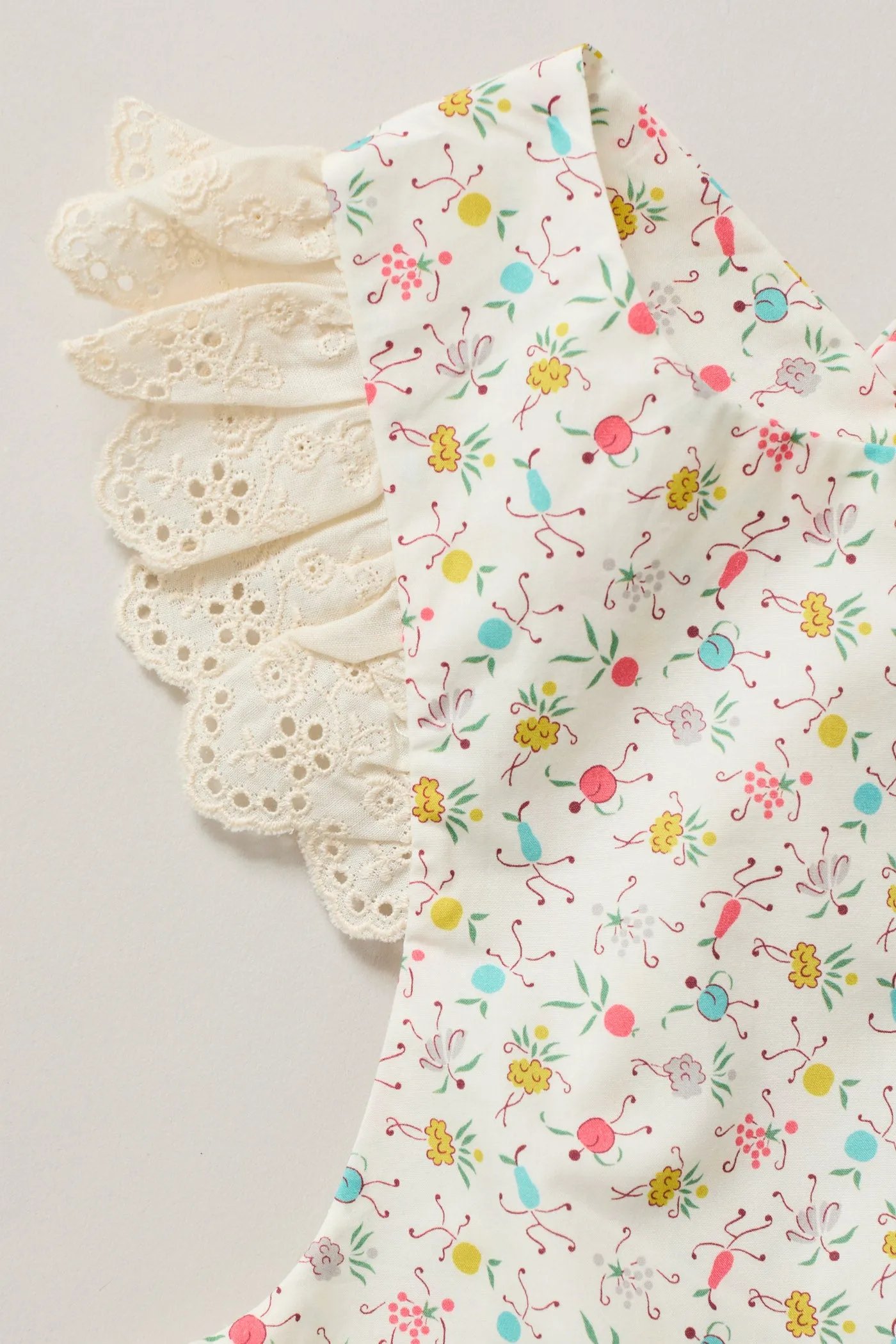 Baby Lace Pinafore in Happy Print