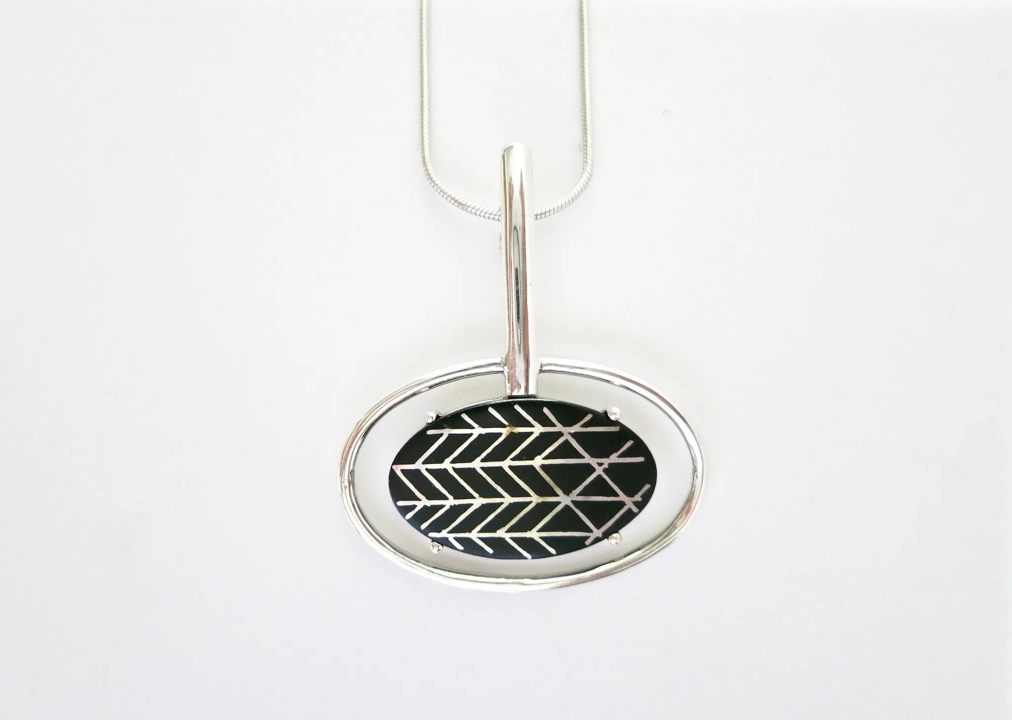 Contemporary, sophisticated oval Bidri pendant